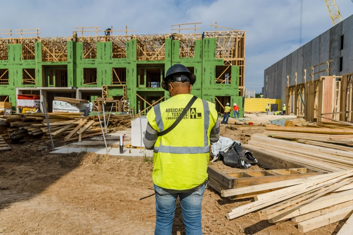 ATL personnel on site at a wood-framed construction project