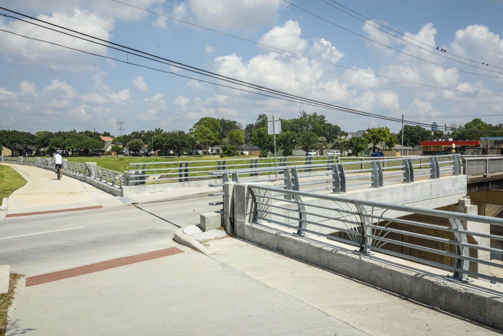 Bridge deck and approach roadway over Brays Bayou from above