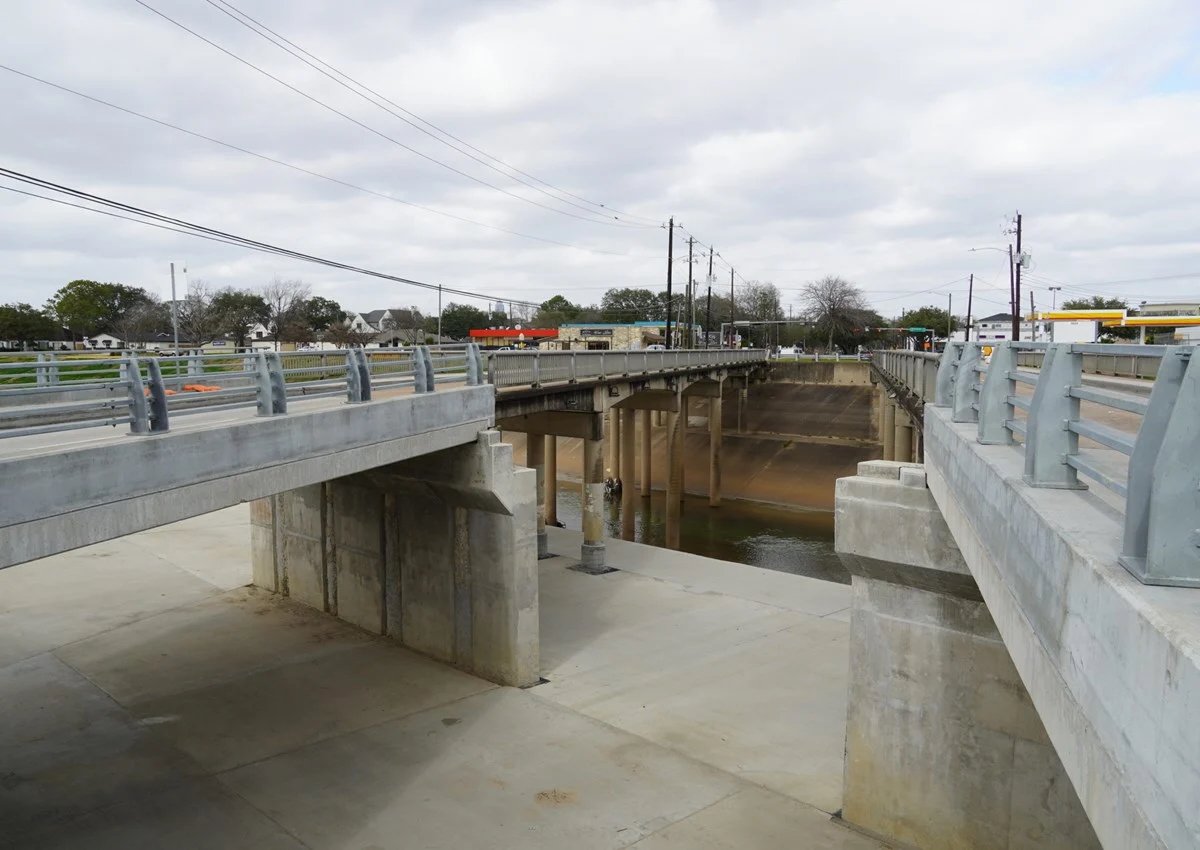 Completed bridge structure and bents seen from the bayou channel below