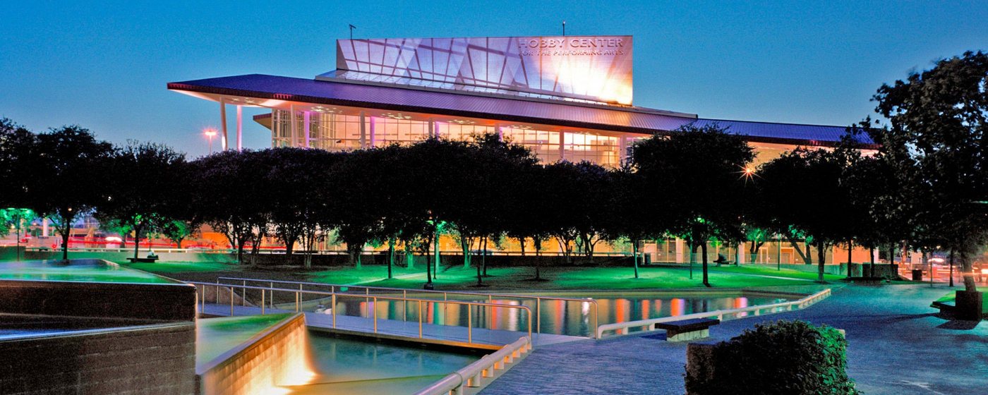 The Hobby Center at twilight above the Tranquility Park reflecting pools