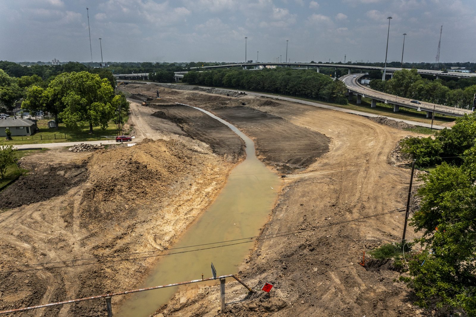 Aerial view of the widened Hunting Bayou channel and its outfall