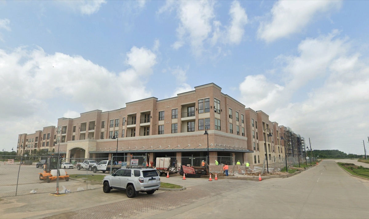 Ivy Lofts under construction — street view with site work in progress