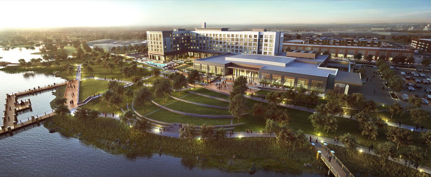 Katy Boardwalk District aerial rendering at sunset — the vision