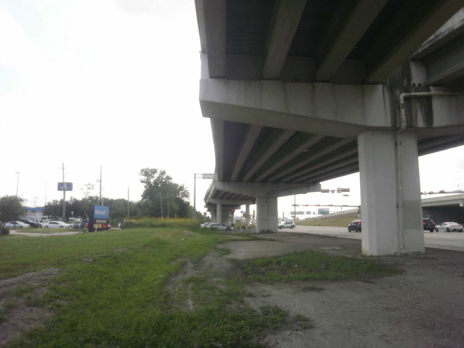 Large-diameter water line corridor passing beneath an elevated freeway