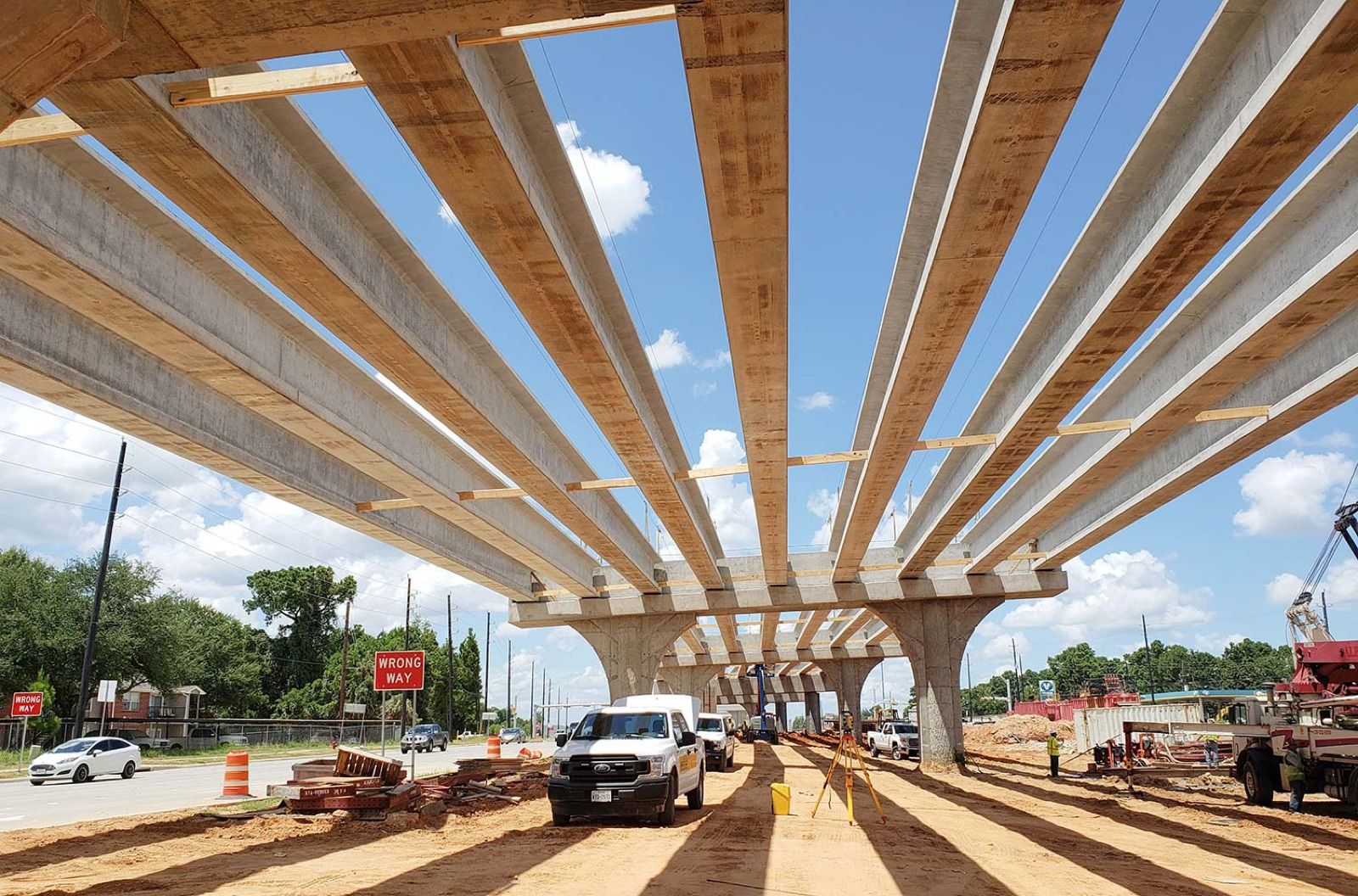 Bridge girders being installed during Tomball Parkway construction