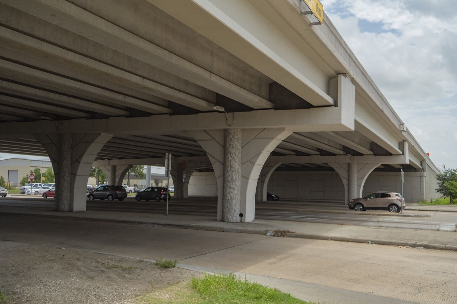 Elevated SH 249 roadway and retaining wall along the corridor