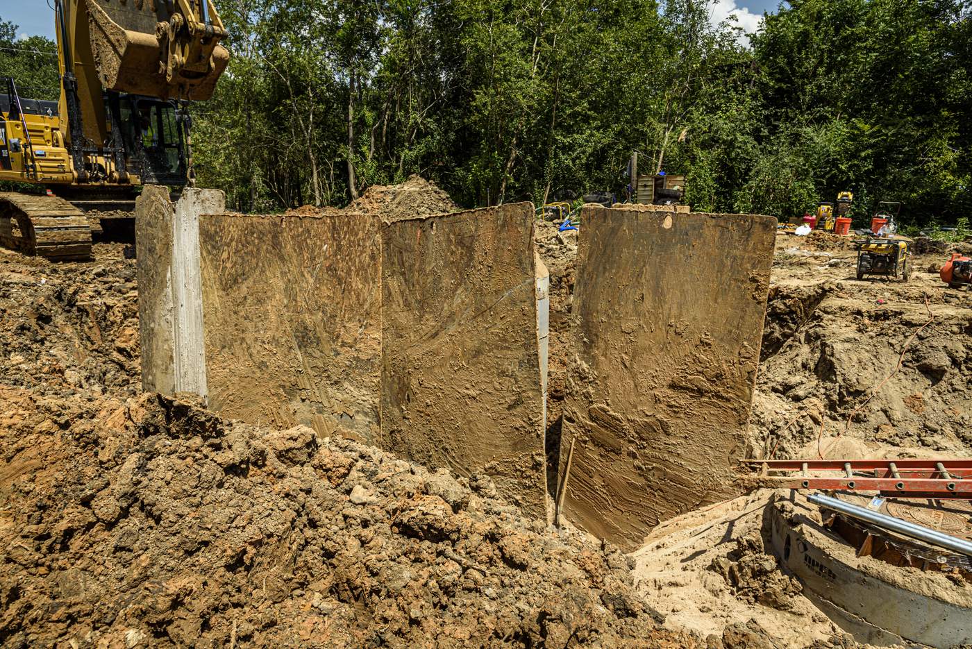 Shored trench walls at the water line tie-in excavation