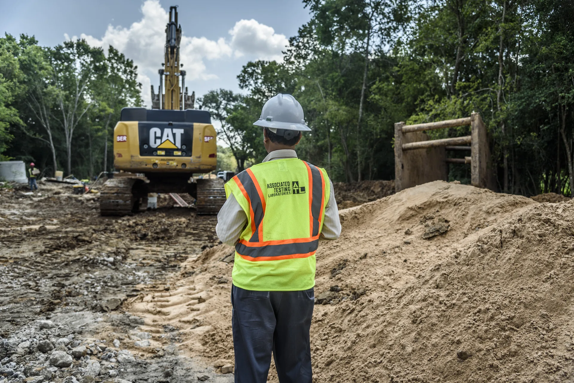 ATL inspector in a hi-vis vest observing site work